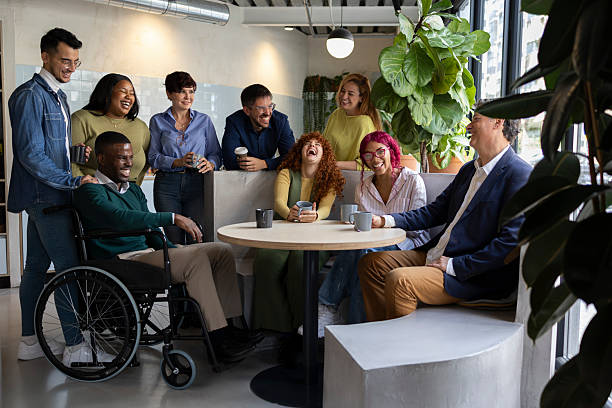 istock Diverse business team enjoying coffee break in modern coworking space 2213399673