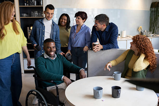 istock Diverse business team enjoying coffee break in modern coworking space 2213399693