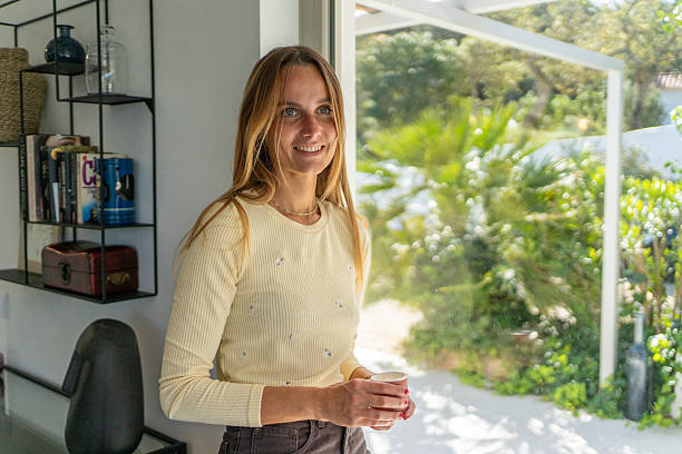 istock Woman at home feeling happy smiling 2213402308