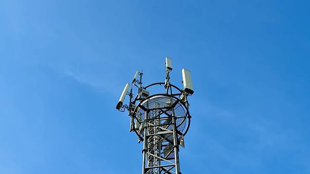 istock A cell tower stands against a clear blue sky, symbolizing modern communication and connection 2213404429