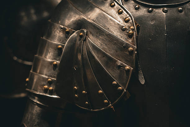 istock Minimalist photograph of medieval armor with dramatic lighting and texture. 2213404444