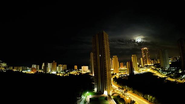 istock A captivating nighttime cityscape with an illuminated skyline, enhanced by moonlight 2213404462