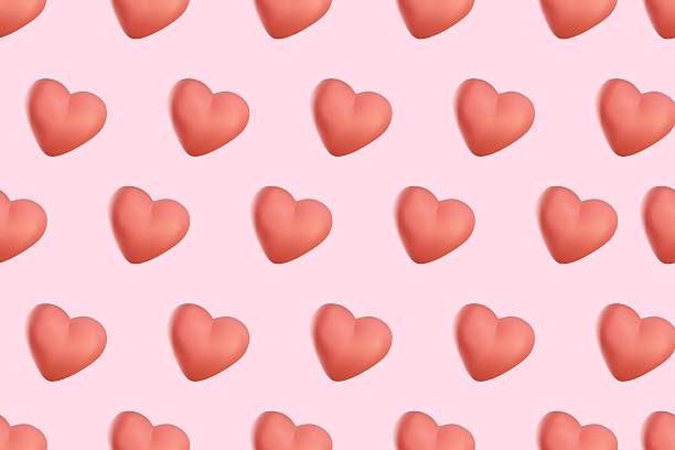 istock Seamless pattern with 3D cartoon cute hearts on pink background. Romantic print, textured elements. Seamless pattern made of red hearts. Vector illustration for Valentine's Day, baby shower, birthday 2213409053