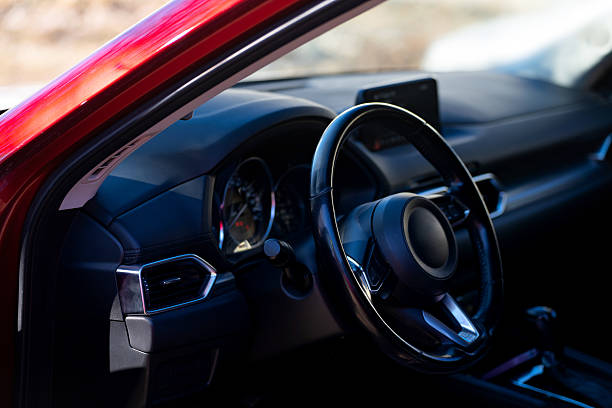 istock passenger car interior, steering wheel and dashboard 2213410769