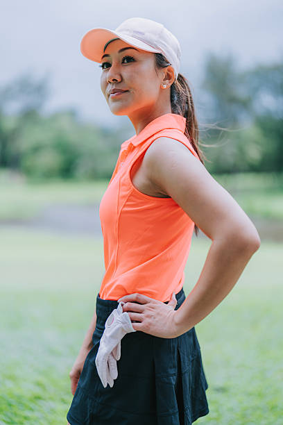 istock Confident Asian Female Golfer Standing Outdoors on a Golf Course 2213416337
