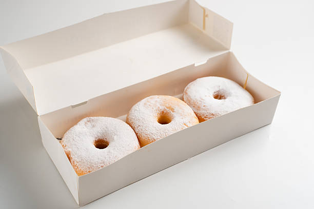 istock Donuts or Doughnuts. Donut or Doughnut boxes with white sugar sprinkles. 2213418225