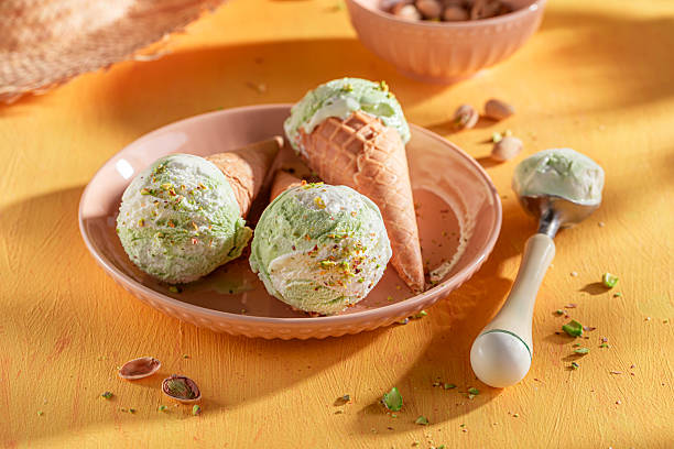 istock Fresh and tasty pistachio ice cream in a waffle cone. 2213419200