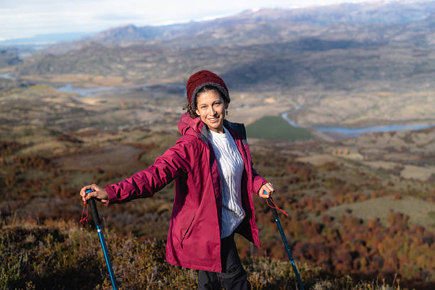 istock Smiling hiker enjoys scenic mountain view during trek 2213419326