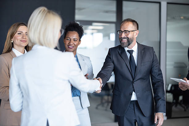 istock Engaging discussion among business professionals in suit 2213421281