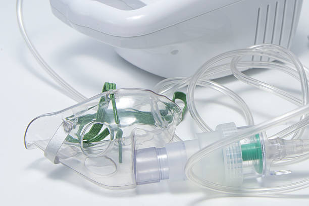 istock A clear plastic mask with a green cord attached to it 2213421394
