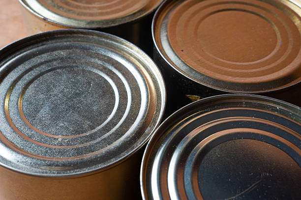 istock Round tin cans with food on the surface 2213428589
