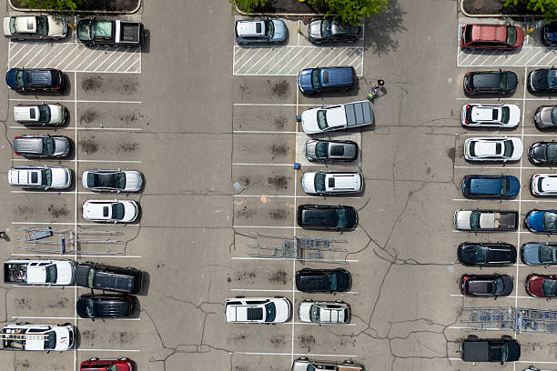 istock Many cars parked in a crowded lot. 2213432813
