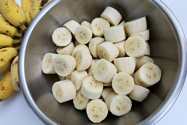 istock Peeling and cutting Banana - food preparation. 2213434900