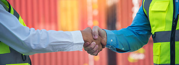 Banner Asian Teamwork Warehouse worker shakehand together. Engineer man, women handshake partnership. Coworker colleague logistics Warehouse teams. Team person shaking hand partner with copy space