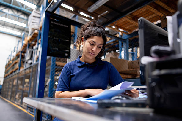 istock Dispatcher looking at an order at a distribution warehouse 2213436376