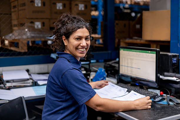 istock Happy employee organizing the inventory while working at a warehouse 2213436377