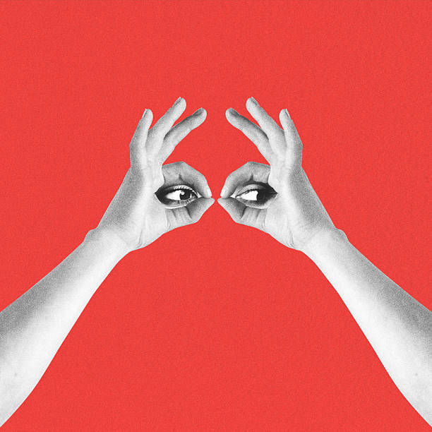 Abstract collage illustration of woman eyes looking through hand fingers. Red background with copy space. Grunge, noise and motion blur effect applied. Retro vintage style