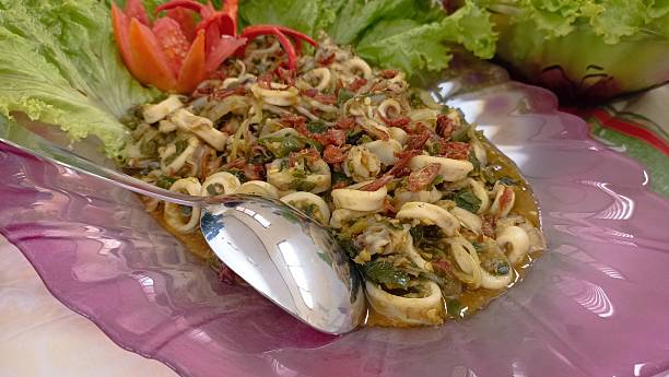 istock A typical Asian squid dish with lettuce leaves as garnish 2213436893