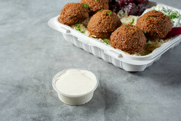 istock cup of tahini sauce 2213436996