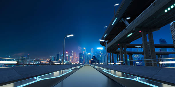 istock 3D Futuristic highway leading to illuminated metropolis at night 2213438037