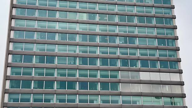 istock A Modern Glass Facade Building featuring Multiple Levels and unique design elements 2213438573