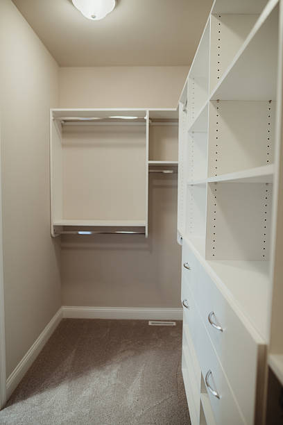 istock Carpeted walk in closet in new home 2213439864
