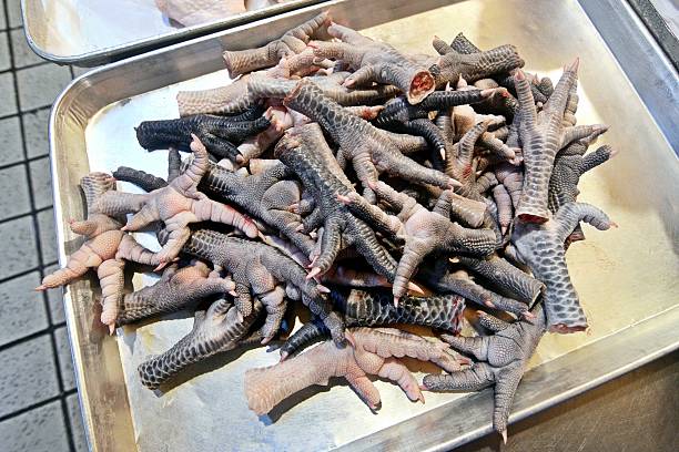 Chicken feet - food preparation.