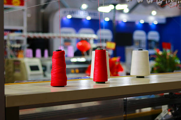 istock Spools of thread for sewing on the background of a sewing machine 2213441219