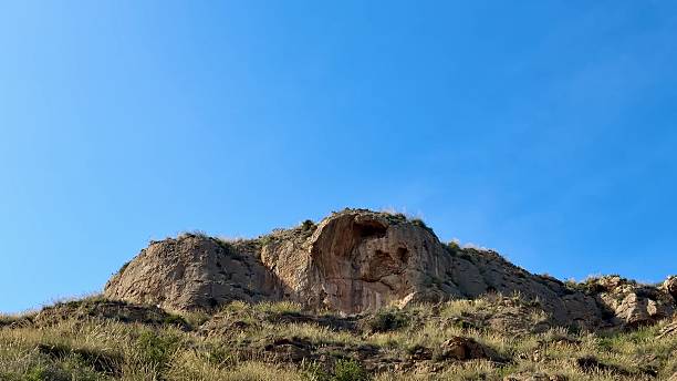 istock A Breathtaking Rock Formation Standing Tall Against a Beautiful Clear Blue Sky Above 2213443085