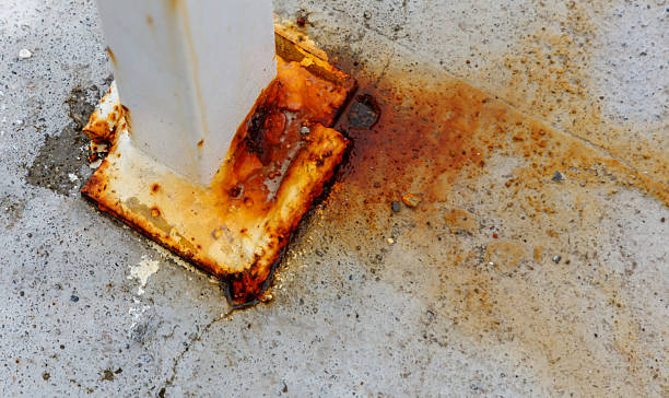 istock A rusty metal pole with a brown substance on it 2213445196