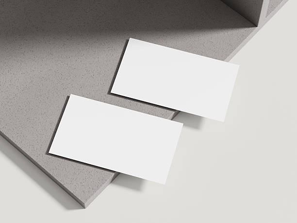 istock A sophisticated business card mockup placed on a beige cement block with subtle shadows, perfect for luxury branding. 2213445783