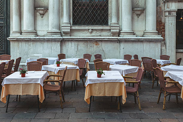Street restaurant tables and chairs in Venice, Italy