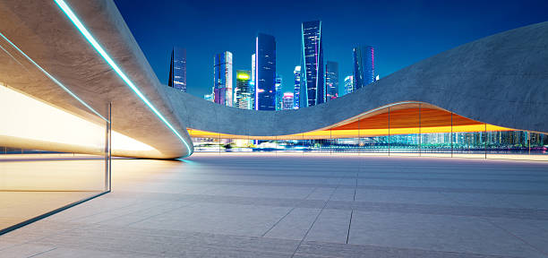 istock 3d rendering Empty parking lot overlooking futuristic illuminated city at night 2213450515