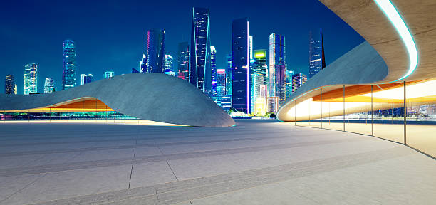istock 3d rendering Modern parking lot structure overlooking illuminated city skyline at night 2213450537