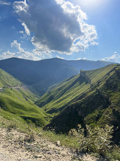 istock Scenic mountain landscape in dagestan featuring verdant hills, blue sky, and dramatic clouds for nature and travel inspiration 2213452171