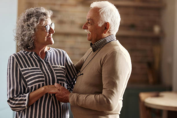 istock Happy senior couple talking at home. 2213454620