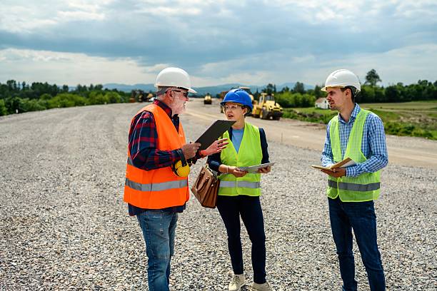 istock Engineers and investor on a road construction site 2213455742
