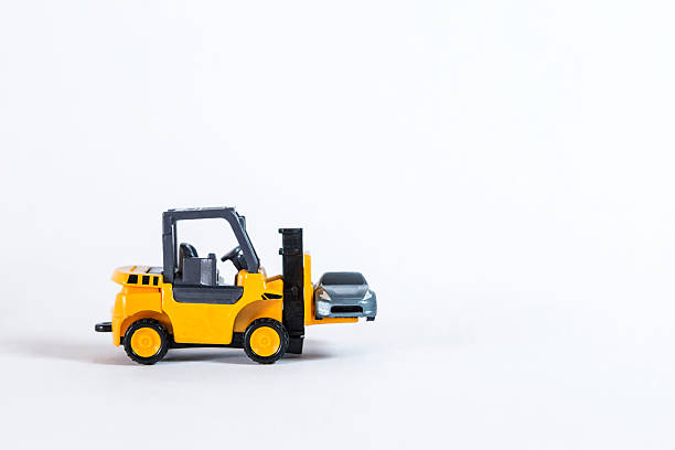 istock Forklift truck with model car isolate on white background, cargo industry 2213455836