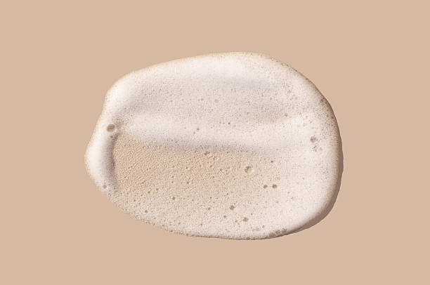 istock texture foam mousse foam cosmetic smear sample on beige background 2213457442