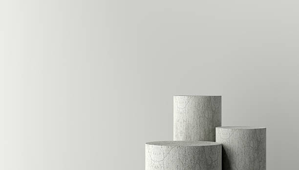 istock Three concrete cylinders creating a minimalist product display on a neutral background 2213458523