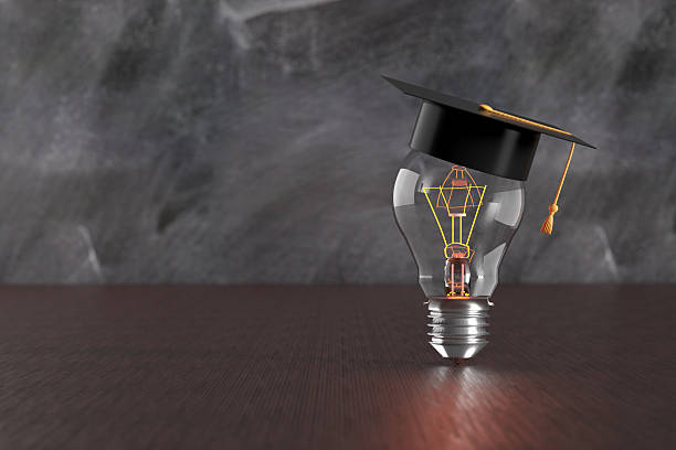 istock Graduation cap on a light bulb promoting educational innovation 2213458526