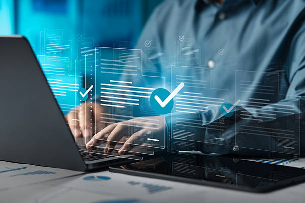 istock Businessman doing online survey to fill out digital document form for business performance review, document management concept, online document database and digital filing system or software. 2213458714