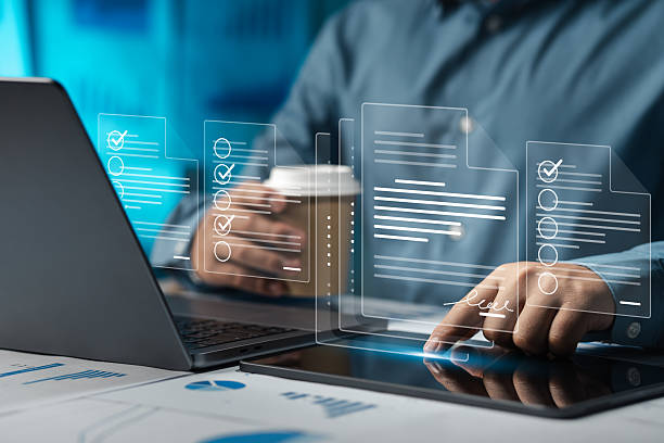 istock Businessman doing online survey to fill out digital document form for business performance review, document management concept, online document database and digital filing system or software. 2213458734