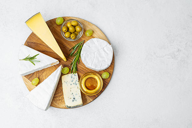 istock Cheese platter with assorted varieties and garnishes for elegant presentation 2213458929