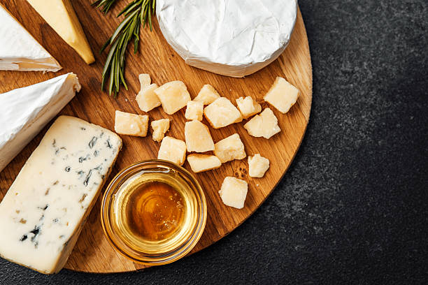 istock Elegant cheese platter with honey and herbs for a gourmet experience 2213458977