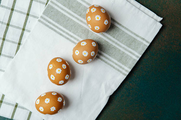 istock Top view  of hand-painted daisy Ester eggs 2213459233