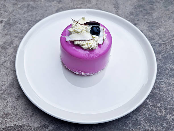 Vanilla blueberry cheesecake decorated with fresh berries