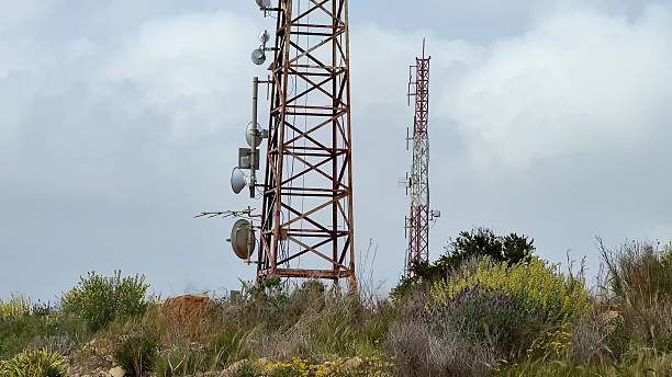 istock A Telecommunication Tower equipped with Antennas standing proudly against a clear Blue Sky 2213461158