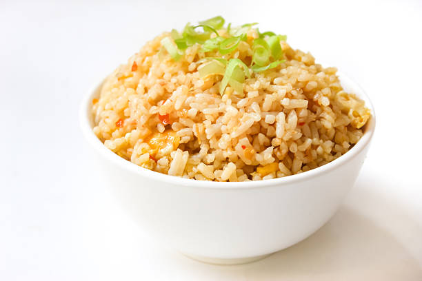 istock a bowl of fried rice isolated on a white background 2213462225