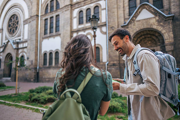 istock Tourists consulting map, exploring a new city together 2213463913
